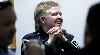 Idaho State Police officer Holly Branch shares a laugh during an  awards luncheon  Wednesday to honor officers who have made the most DUI arrests. Branch has won the award four years in a row, this year with 35 DUI arrests. The Spokeman-Review (KATHY PLONKA The Spokeman-Review / The Spokesman-Review)