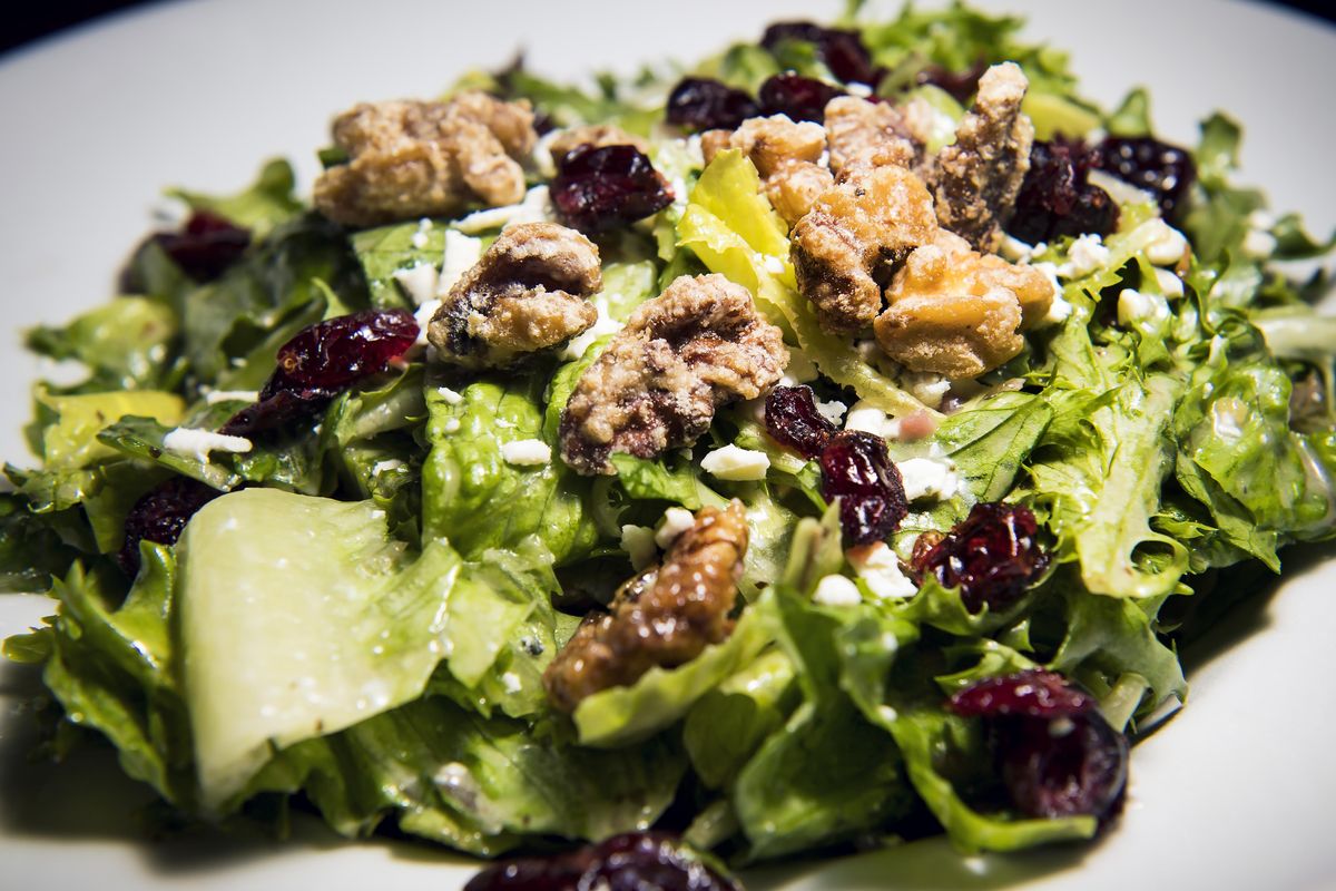 Twigs Insalada Mista House Salad. A blend of romaine and baby spring greens tossed with Gorgonzola crumbles, candied walnuts and dried cranberries in a red wine vinaigrette. (Colin Mulvany / The Spokesman-Review)