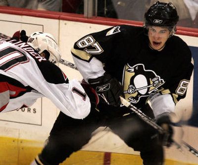 The National Hockey League's altered rules are a boost to Pittsburgh Penguins rookie Sidney Crosby, right, who can use his finesse without worrying about vicious hits.
(Associated Press / The Spokesman-Review)