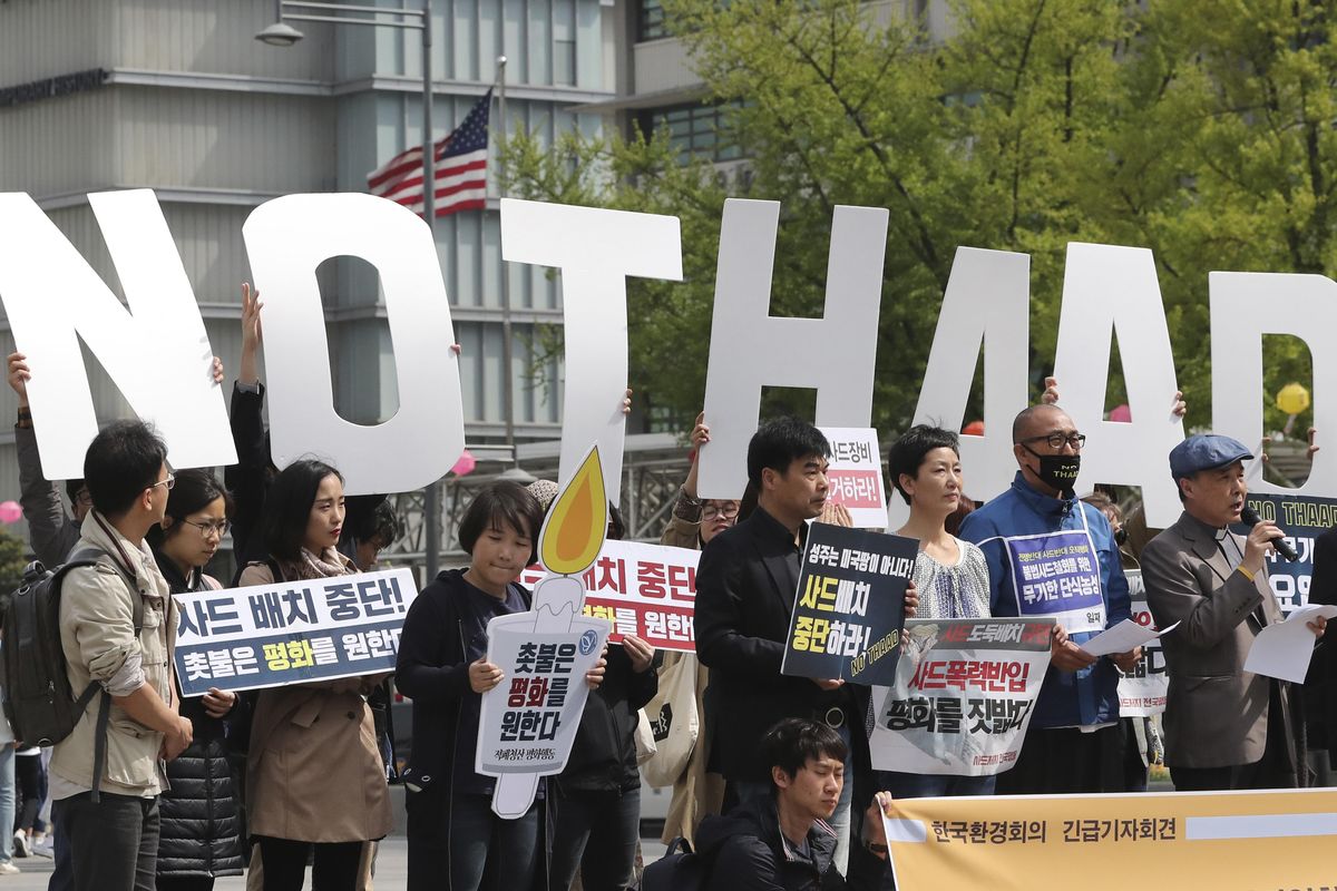 South Koreans rally Friday to oppose a plan to deploy an advanced U.S. missile defense system called Terminal High-Altitude Area Defense, or THAAD, near the U.S. Embassy in Seoul, South Korea. (Lee Jin-man / Associated Press)