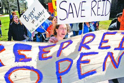 
Sara Preisig leads a crowd of about 50 people attending a rally in support of  Reid Elementary school at Eastern Washington University on Wednesday in Cheney. EWU faculty, staff and students along with parents demonstrated support for the school that may close because it badly needs repairs. 
 (Dan Pelle / The Spokesman-Review)