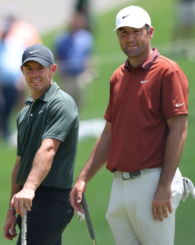 Rory McIlroy of Northern Ireland and Scottie Scheffler of the United States look on from the sixth green during the first round of the PGA Championship at Quail Hollow Country Club on May 15, 2025, in Charlotte, North Carolina.  (Tribune News Service)