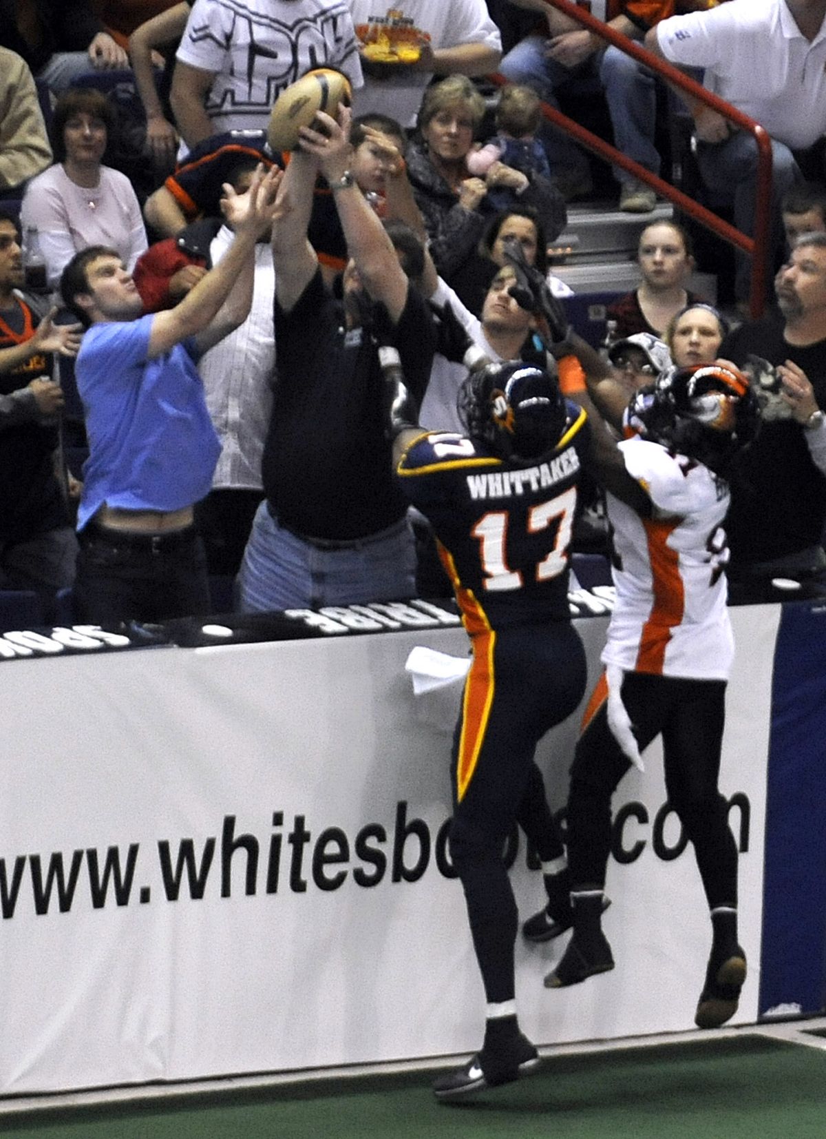 A fan grabs a reception instead of Spokane Shock's Huey Whittaker in the first quarter Friday in the Spokane Arena Fri. April 2, 2010. colinm@spokesman.com COLIN MULVANY (Colin Mulvany / The Spokesman-Review)