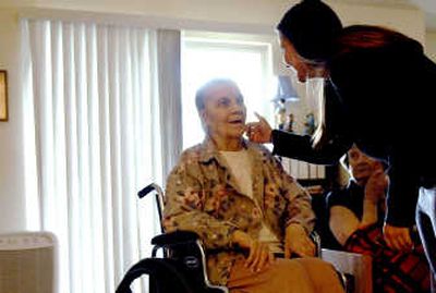 
Lorraine Frederick, left, talks with Amanda Witthauer at Sunset Homes in Post Falls last month. Witthauer recently opened the adult care facility. 
 (Kathy Plonka / The Spokesman-Review)