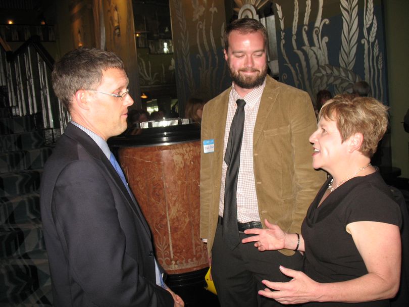 Spokane City Councilman Jon Snyder, left, and Paul Dillon, legislative aide to state Rep. Andy Billig, greet state Senate Majority Leader Lisa Brown at her farewell celebration on Wednesday, May 9, at the Matin Woldson Theater at the Fox. Snyder is running for the state House seat currently held by state Rep. Andy Billig. Brown, who announced last week that she would not seek a new term, has endorsed one of Snyder's opponents in the race, Marcus Riccelli, her senior policy analyst. (Jonathan Brunt)
