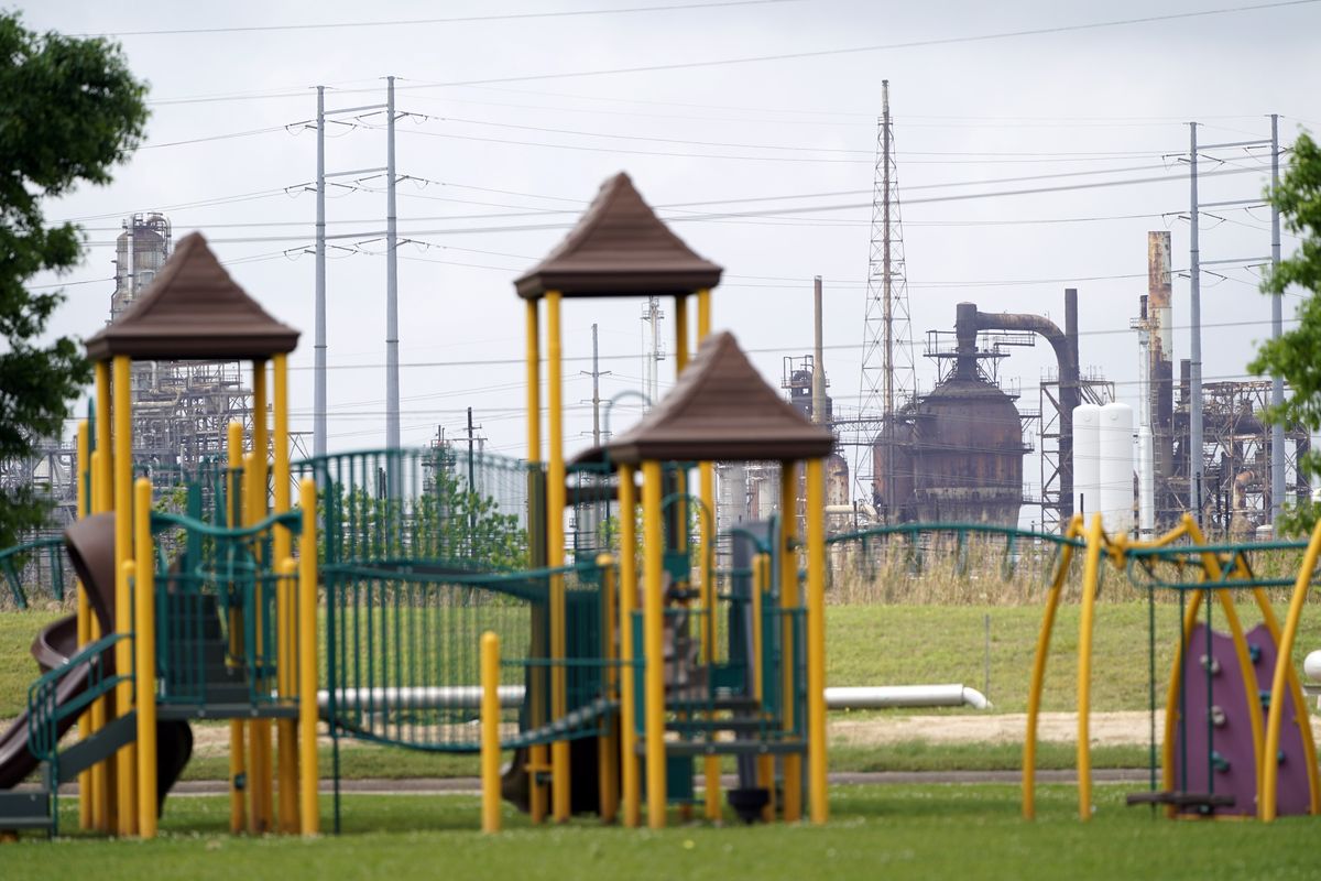 A playground outside the Prince Hall Village Apartments sits empty near one of the petrochemical facilities in Port Arthur, Texas.  (David J. Phillip)