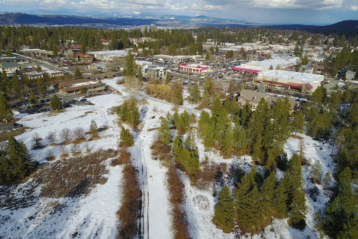 This undeveloped property on Spokanes South Hill, southwest of the intersection of 29th Ave. and Southeast Blvd. may soon be developed with houses, multi-family units and commercial development by Greenstone. The commercial development above is the Lincoln Heights area. Photographed Monday, Mar. 5, 2018. (Jesse Tinsley / The Spokesman-Review)