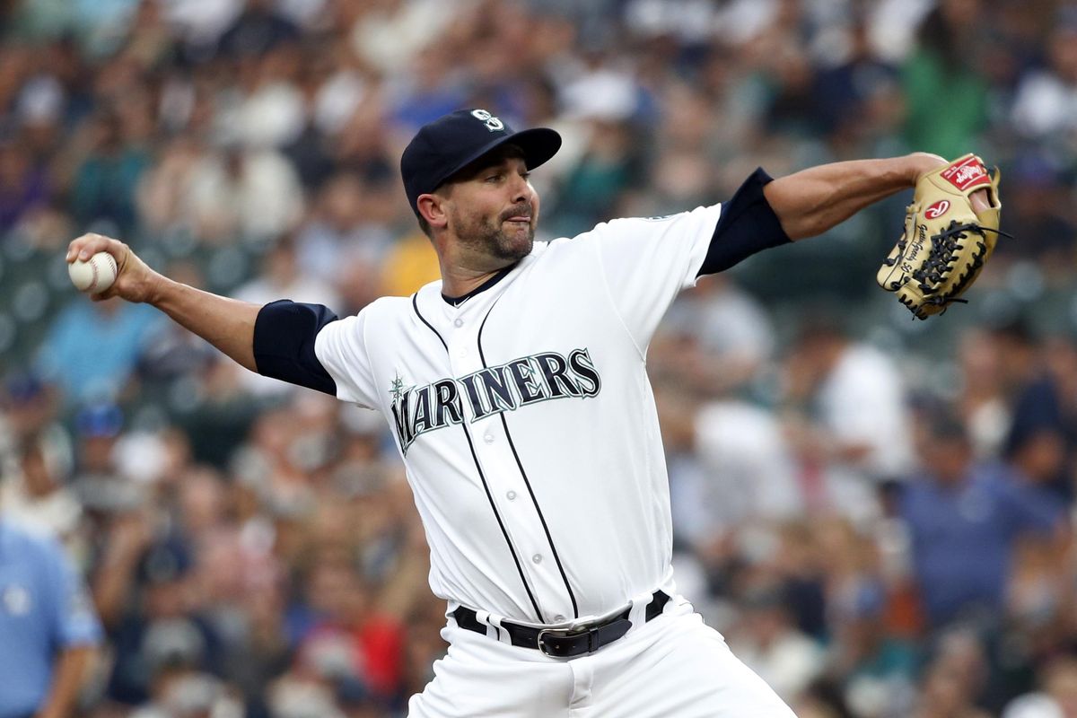 Seattle Mariners starting pitcher Nick Vincent throws against the Houston Astros during the first inning Tuesday in Seattle. (Jennifer Buchanan / AP)