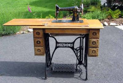 
Antique sewing machines like this 1903 Singer model in a golden oak cabinet bring back memories.
 (Cheryl-Anne Millsap photo / The Spokesman-Review)