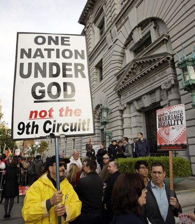 Steve Harris carries a sign against gay marriage outside of the courthouse before a hearing in the 9th Circuit Court of Appeals on Monday in San Francisco.  (Associated Press)