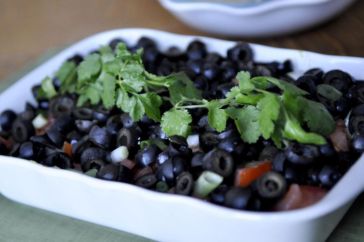 This Nine Layer Dip doesn’t require cooking as much as it does assembling. (Adriana Janovich / The Spokesman-Review)