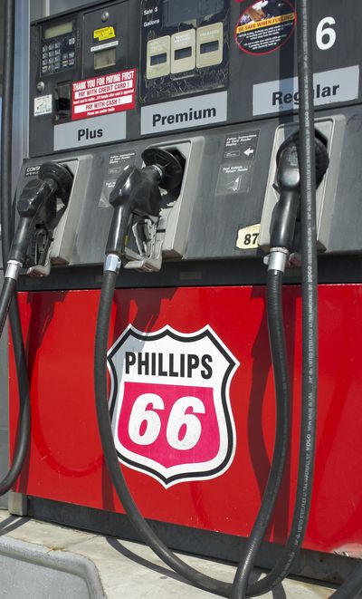 In this July 22, 2011, file photo, pumps at a Phillips 66 gas station display the company logo in Omaha, Neb. (Nati Harnik / Associated Press)
