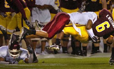 
WSU's Benny Ward levels ASU punt returner Kyle Williams. 
 (Christopher Anderson / The Spokesman-Review)