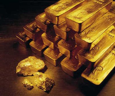 
Gold nuggets and bars are shown in this   photo from  Newmont Mining Corp. Associated Press
 (File Associated Press / The Spokesman-Review)