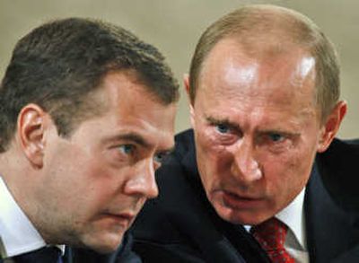 
Russian President Vladimir Putin, right, speaks with Dmitry Medvedev  in October. Associated Press
 (File Associated Press / The Spokesman-Review)