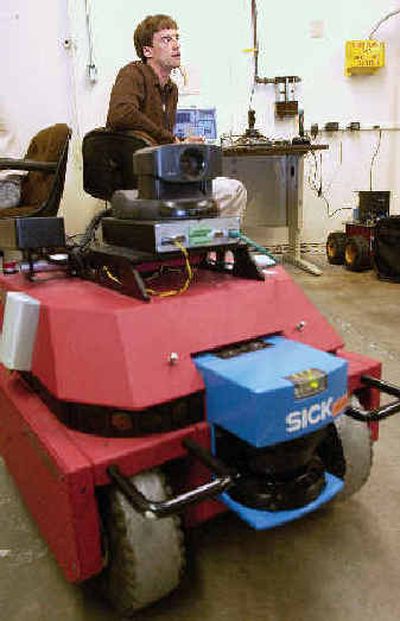 
Idaho National Engineering and Environmental robotics project manager Dave Bruemmer talks  last week about the practical applications of robots being built at the research facility in Idaho Falls. 
 (Associated Press / The Spokesman-Review)