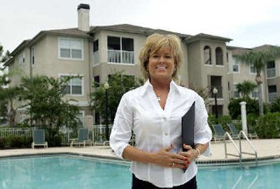 
Diane Lee, president of DLG Management Services, poses outside the Preserve at Mobbly Bay apartments in Tampa, Fla. The new owners of the Preserve at Mobbly Bay had every intention of converting the apartments to condos when they bought the 17-building complex in November of last year. 
 (Associated Press / The Spokesman-Review)