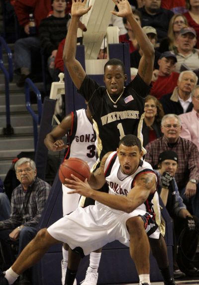 Gonzaga's Robert Sacre, foreground, tries to drive against Wake Forest's Al-Farouq Aminu in the first half of an NCAA college basketball game at McCarthey Athletic Center in Spokane, Wash., Saturday, Dec. 5, 2009. (Rajah Bose / Fr120940 Ap)