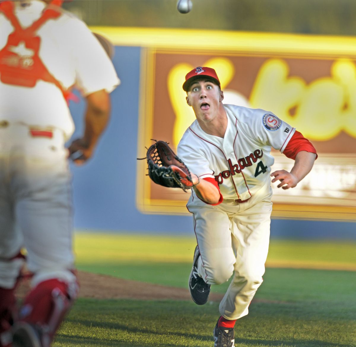 Spokane Indians pitcher Kevin Matthews is all eyeballs as he charges off the mound to catch a pop-up on a bunt attempt. (Christopher Anderson)