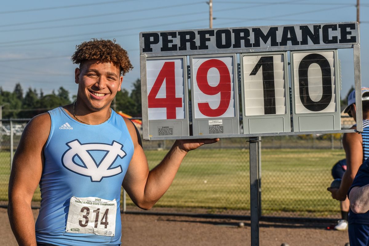 Central Valley’s Brandon Thomas poses with his state-record mark in the ambulatory shot put at the State 4A championships at Mount Tahoma High School on Thursday.  (Keenan Gray/FOR THE SPOKESMAN-REVIEW)