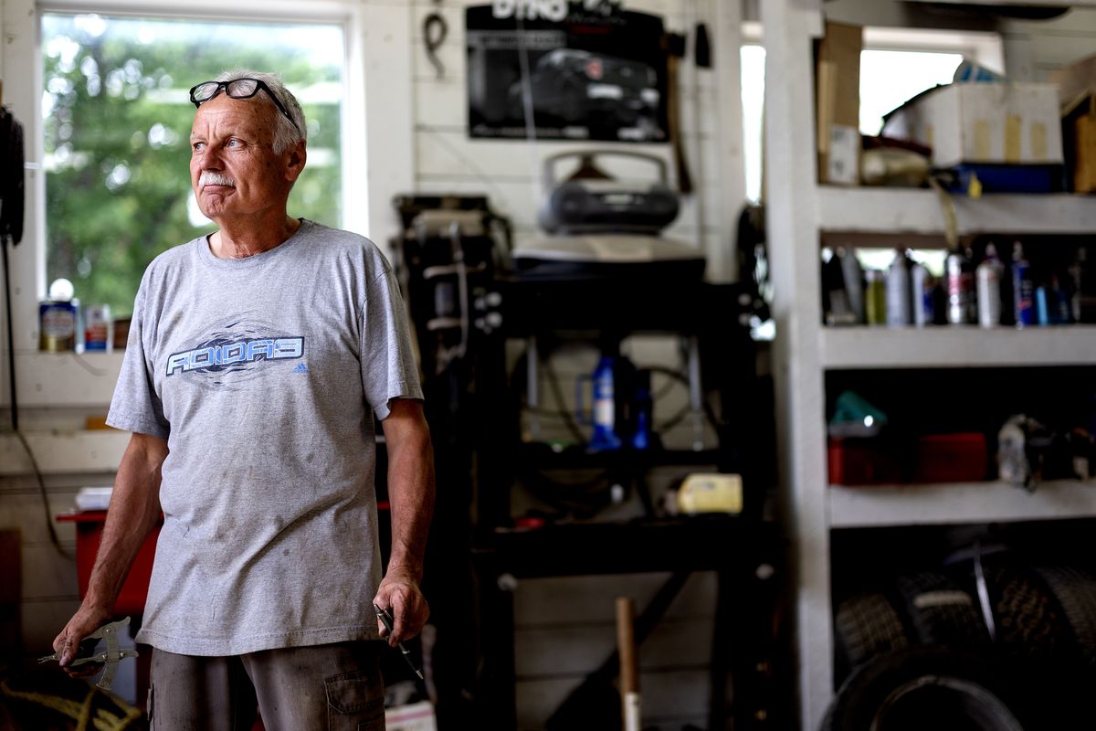 Ken Lachnit, 66, takes a break from inspecting a car at his business The Woodridge Garage on Aug. 12 in Woodridge, Manitoba, Canada. Lachnit is also a volunteer firefighter. (Carlos Gonzalez/Minnesota Star Tribune/TNS)