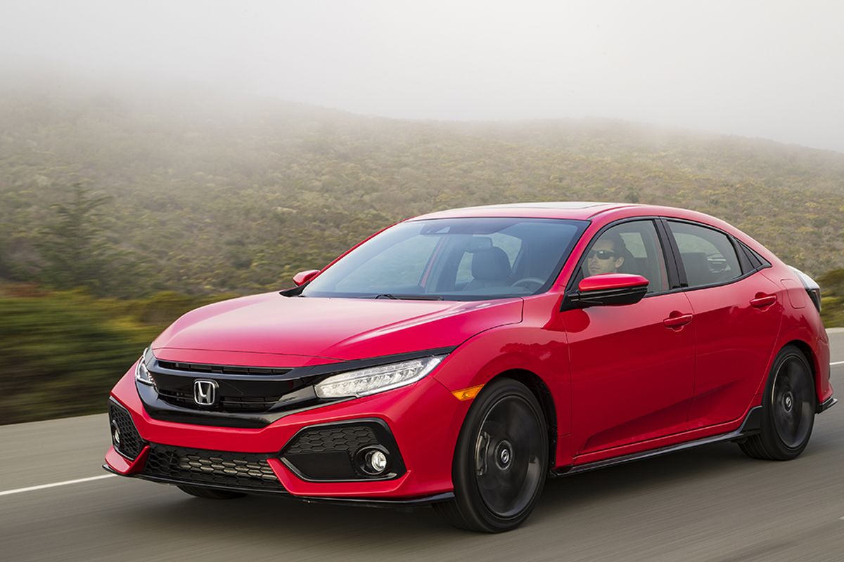 Honda redesigned the Civic from the ground up last year, rolling it out in sedan and coupe body styles. This year, it resurrects the four-door hatchback.  (Honda)