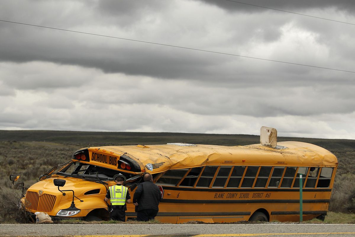 Emergency personnel work at the scene of a school bus crash Tuesday, April 18, 2017, west of Richfield, Idaho. (DREW NASH / Times-News)