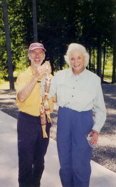 Rich Landers poses with Sandra Day O’Connor and a stringer of wood-carved trout after they were skunked while fishing the St. Joe River.  (Rich Landers)
