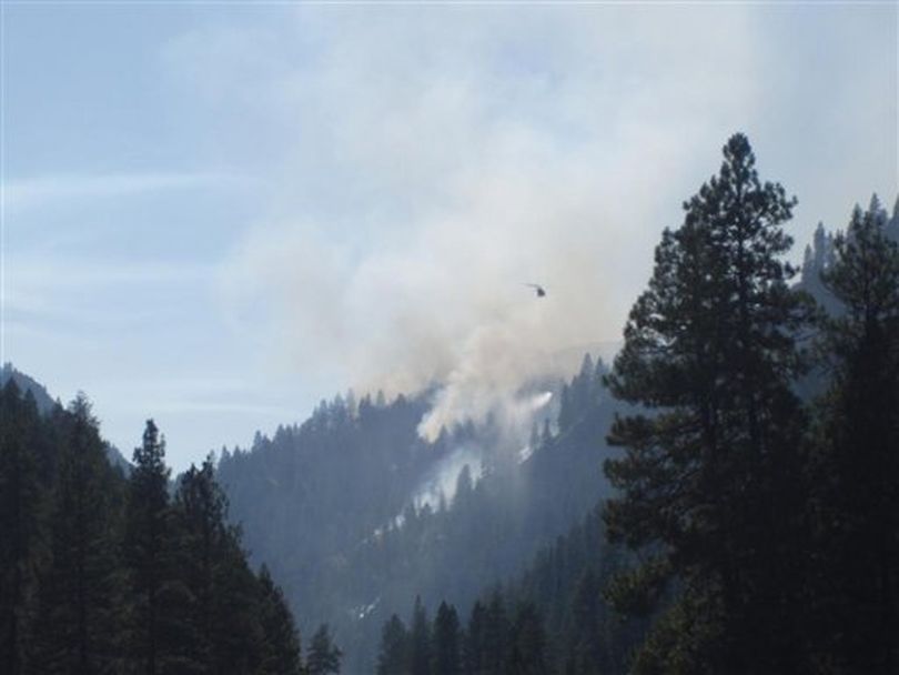 This photo provided by the Boise National Forest shows the Springs Fire, 4 miles east of Banks, Idaho, along Highway 17. So far it's burned more than 600 acres, but fire officials said Tuesday, Aug. 7, 2012 that it is 30 percent contained. (AP / Boise National Forest)