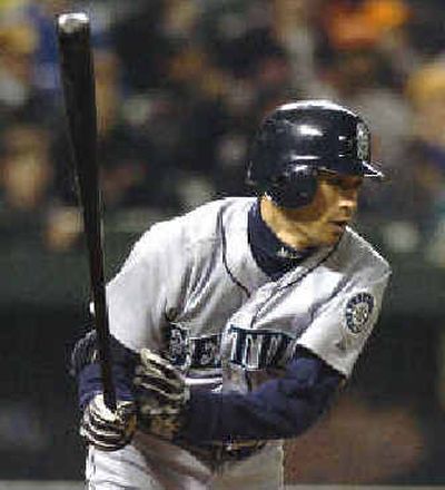 
Seattle's Ichiro Suzuki, who went 3 for 3 on Tuesday, follows through on a seventh-inning single off Baltimore's Todd Williams. 
 (Associated Press / The Spokesman-Review)