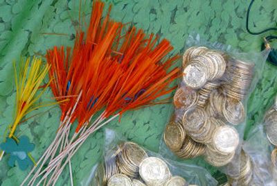 
Flashes of color for the rainbow and lots of fake gold coins decorate  the parade float Shannon Erwin was building for O'Shay's Irish Pub and Eatery on Thursday afternoon. 
 (Jesse Tinsley / The Spokesman-Review)