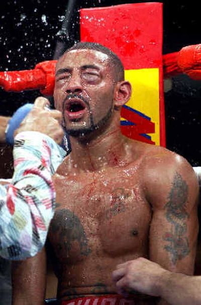 
Diego Corrales has water splashed on his face before the ninth round during Saturday's win over Jose Luis Castillo. 
 (Associated Press / The Spokesman-Review)