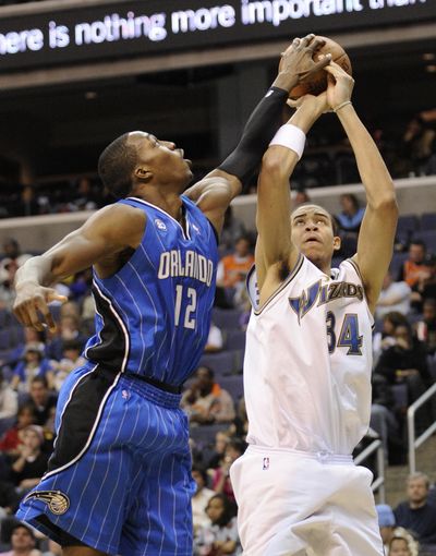 Orlando’s Dwight Howard rejects Washington’s JaVale McGee. (Associated Press / The Spokesman-Review)