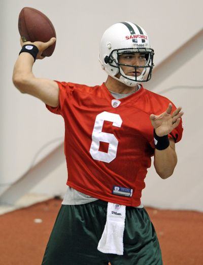 Mark Sanchez can concentrate on football after signing contract.  (Associated Press / The Spokesman-Review)