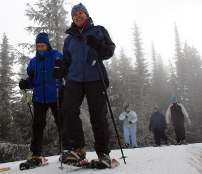 Carol Gauper and Annette Sanburn join a guided snowshoeing trek at last winter’s Souper Bowl.  (File / The Spokesman-Review)