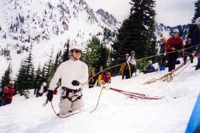 
Brian Hoots demonstrates the strength of snow anchors near Stevens Peak during the 