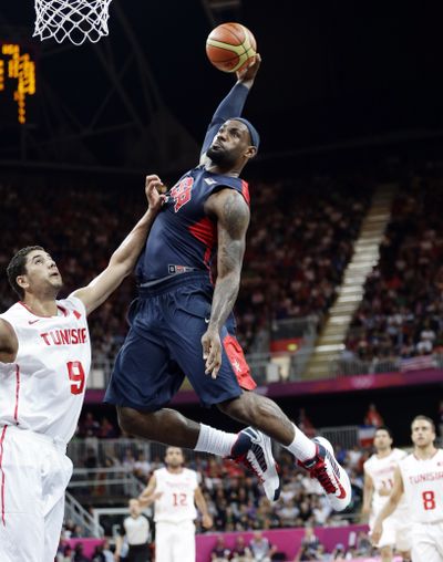LeBron James dunks Tuesday for the United States men’s team. (Associated Press)