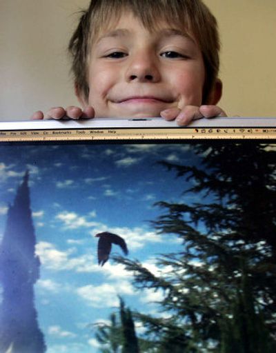 
Gabriel Gottfried, 5, and his photo of the condor that paid a visit to his Los Angeles neighborhood. 
 (Los Angeles Times / The Spokesman-Review)