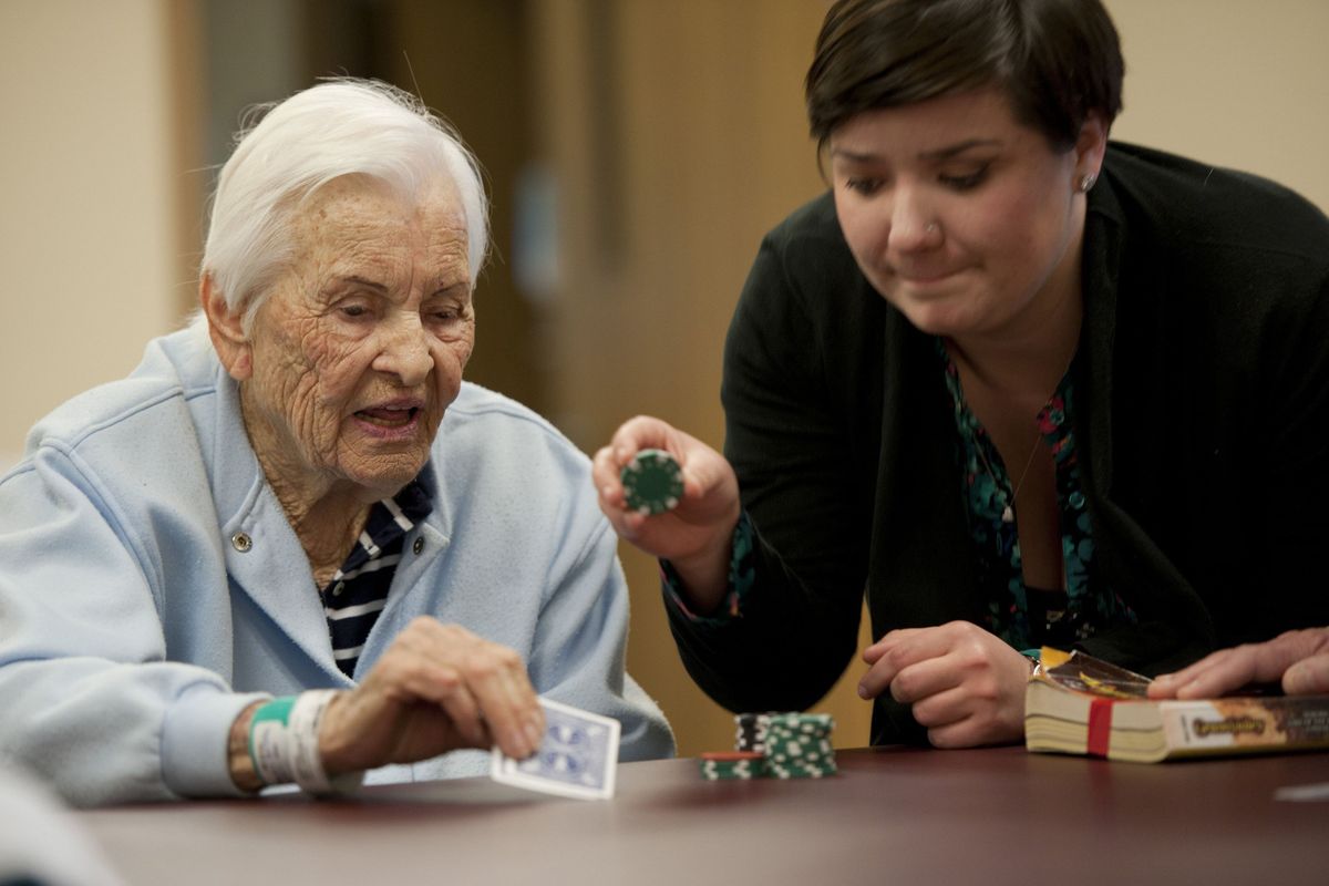 Adele Best, 89, plays blackjack with help from recreational therapist intern Cherie Lundgren at the Sutter Rehabilitation Institute in Roseville, Calif.