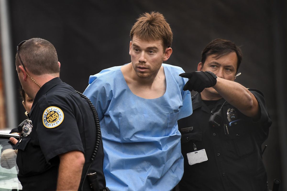 Travis Reinking, suspected of killing four people in a late-night shooting at a Waffle House restaurant, is escorted into the Hill Detention Center on Monday, April 23, 2018, in Nashville, Tenn. (Lacy Atkins / AP)