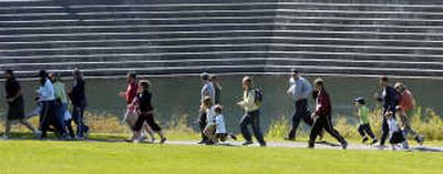 
Children and adults make their way along the Spokane River during last year's 1.2-mile Marmot March in Riverfront Park. 
 (Dan Pelle / The Spokesman-Review)