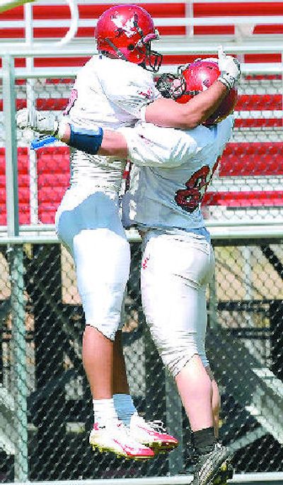 
Wide receiver Aaron Boyce, left, celebrates his TD with teammate Tom McAndrews. 
 (Brian Plonka / The Spokesman-Review)