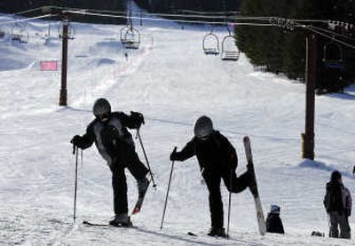
Kevin and Rachel Basnaw of Riverside, Wash. – on a day off from school – stretch their legs before heading up the hill Friday at 49 Degrees North near Chewelah, Wash.  They were practicing before their evening ski lessons. 
 (Dan Pelle / The Spokesman-Review)