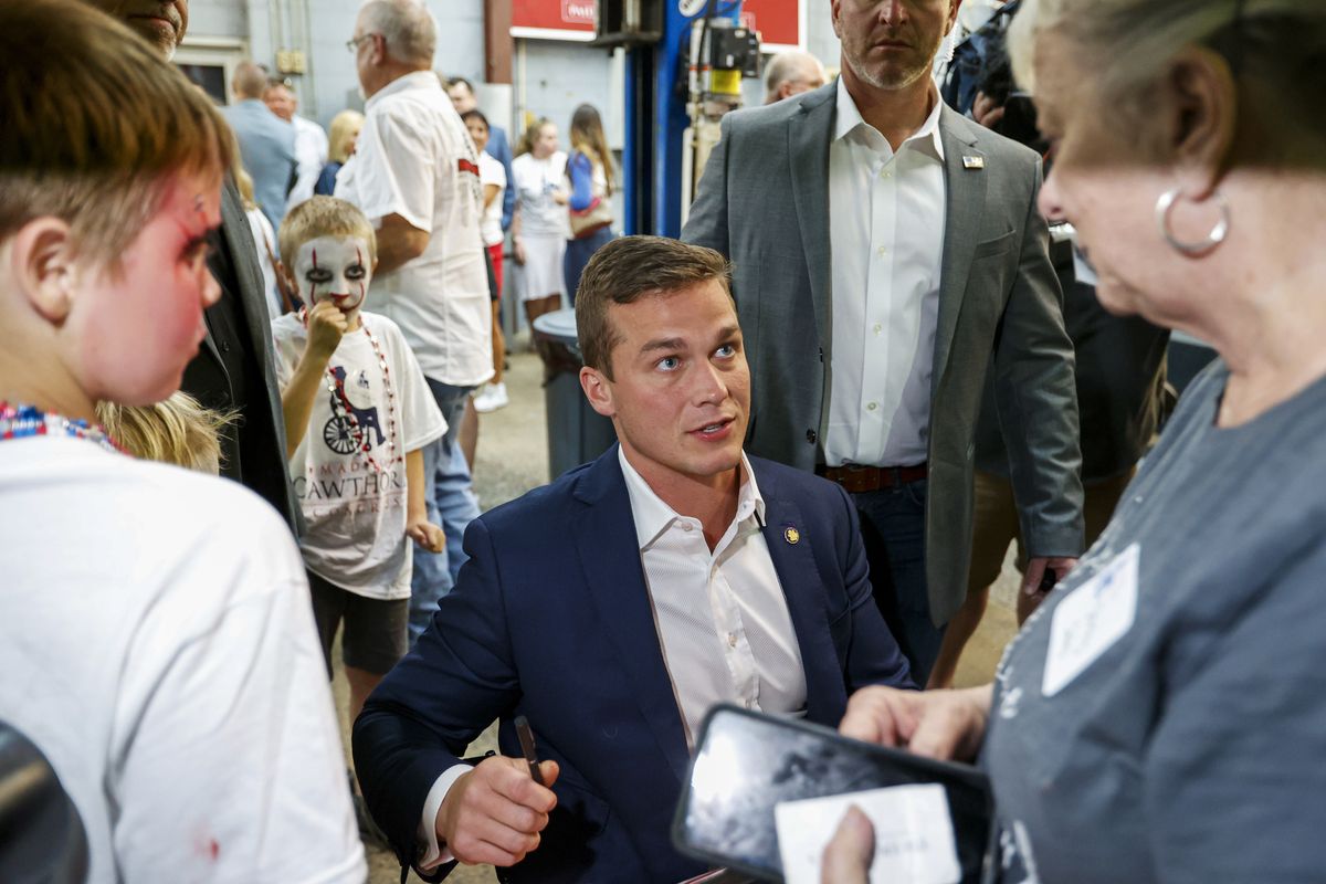 U.S. Rep. Madison Cawthorn, R-N.C., talks to supporters at his primary election night watch party in Hendersonville, N.C., Tuesday, May 17, 2022.  (Nell Redmond)