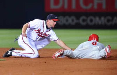 
Atlanta's Chipper Jones, left, didn't play Sunday and may miss two more games. Associated Press
 (Associated Press / The Spokesman-Review)