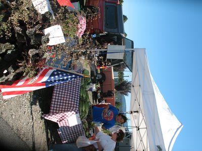Communities interested in improving and possibly embracing sustainability can benefit more from smaller-scale operations like farmers' markets, such as the weekly one in Liberty Lake, as opposed to larger stores like Wal-Mart.  (Down to Earth NW file photo)