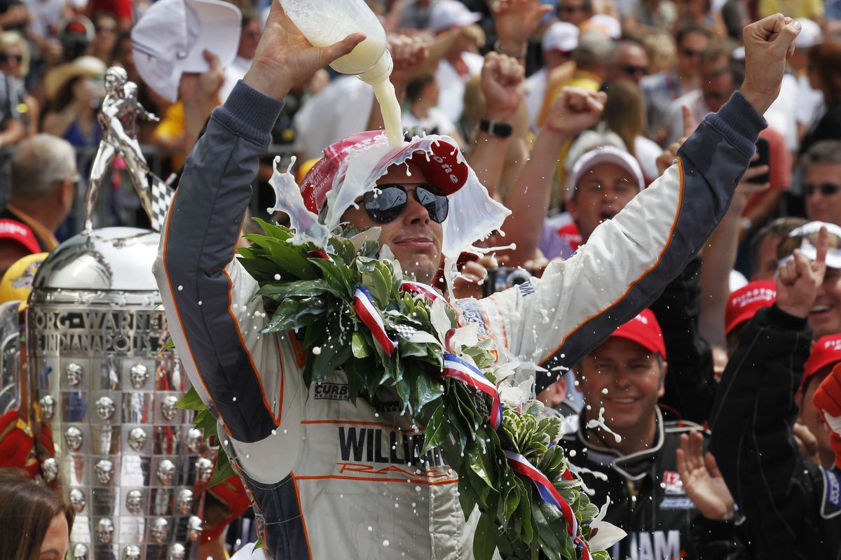 Dan Wheldon continues the tradition of the winner dousing himself with milk after a thrilling Indianapolis 500 victory Sunday. (Associated Press)