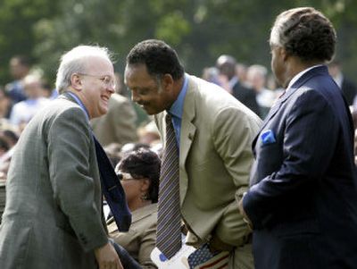 
Karl Rove, left, White House political adviser, stops to greet the Rev. Jesse Jackson, center, and the Rev. Al Sharpton at a Voting Rights Act of 2006 signing ceremony on Thursday.
 (Associated Press / The Spokesman-Review)