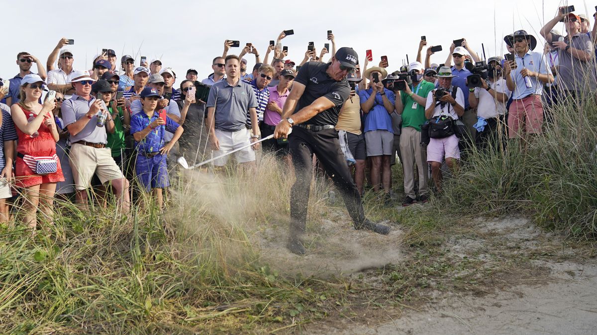 Phil Mickelson hits his second shot on the 16th hole from the rough during the third round at the PGA Championship golf tournament on the Ocean Course on Saturday in Kiawah Island, S.C.  (David J. Phillip)