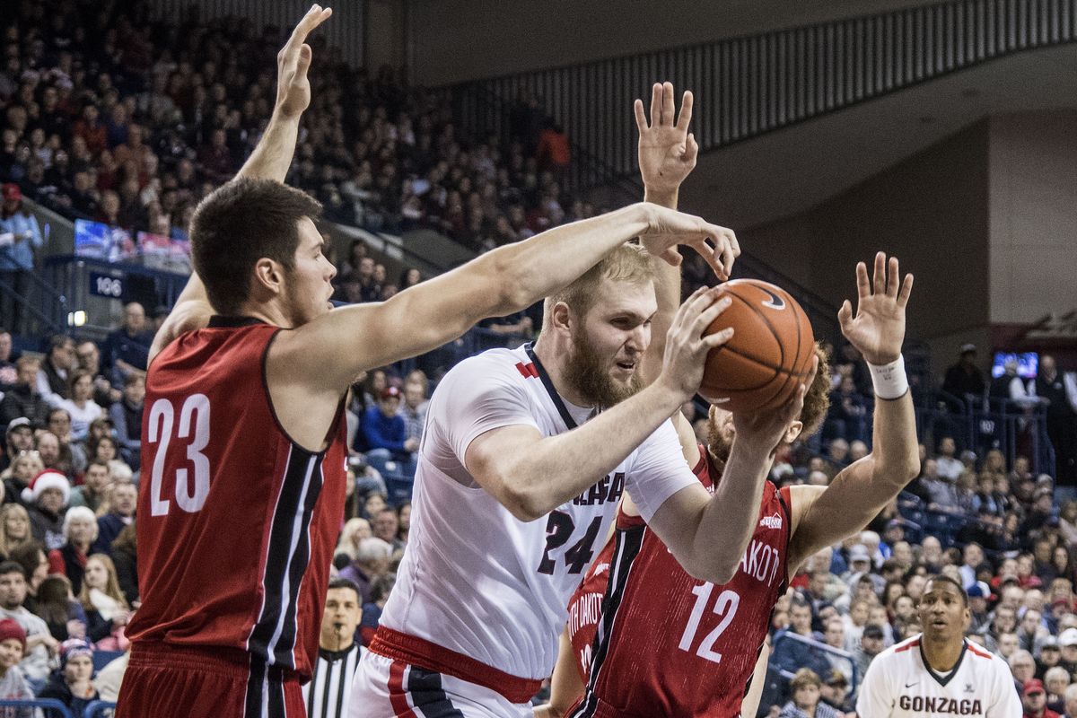 Gonzaga center Przemek Karnowski fights through the South Dakota defense on  Dec. 21, 2016. He hasn’t been home in Poland for the holidays since his first year at Gonzaga in 2012. (Dan Pelle / The Spokesman-Review)